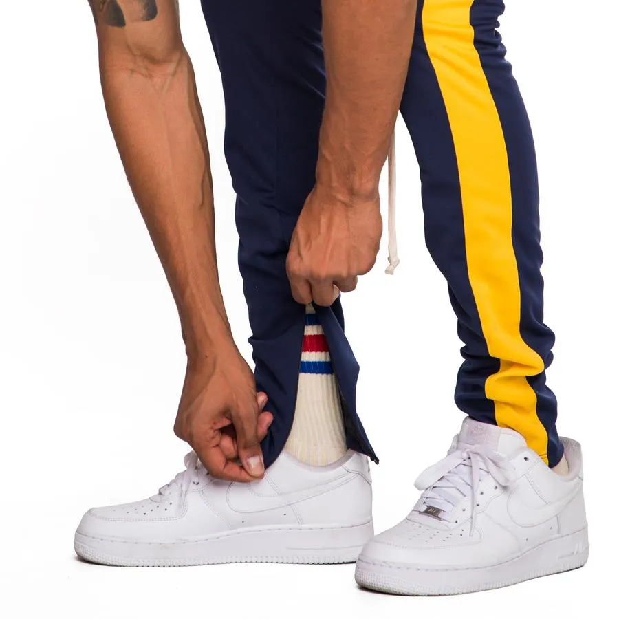 EPTM Techno Track Pants in Navy/Gold